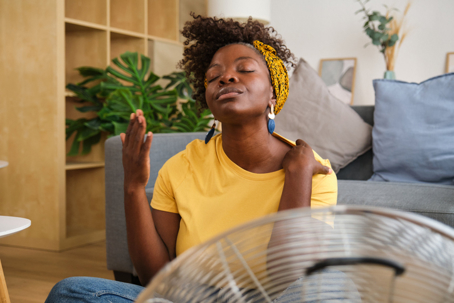 woman overheating at home